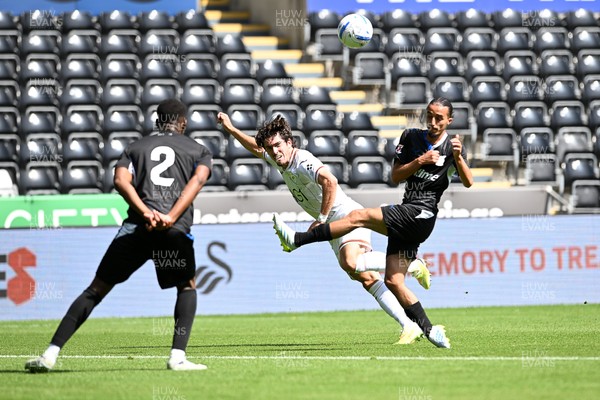 010826 - Swansea City v CD Leganes - Preseason Friendly - Josh Key of Swansea City is challenged by Yassine Kechta of Leganes
