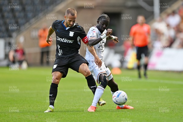 010826 - Swansea City v CD Leganes - Preseason Friendly - Moussa Yeo of Swansea City is challenged by Enric Franquesa of Leganes