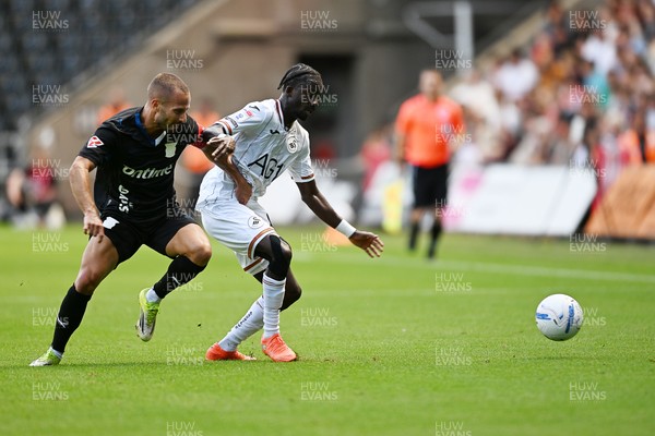 010826 - Swansea City v CD Leganes - Preseason Friendly - Moussa Yeo of Swansea City is challenged by Enric Franquesa of Leganes
