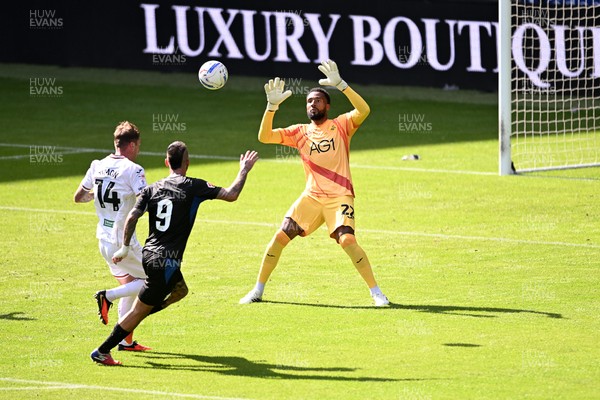 010826 - Swansea City v CD Leganes - Preseason Friendly - Alejandro Millan Iranzo of Leganes attempts a lob over Lawrence Vigouroux of Swansea City
