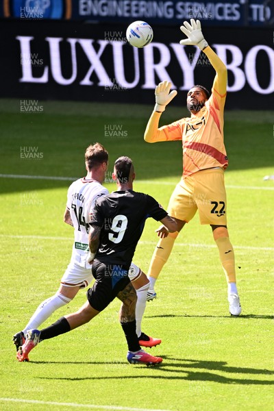 010826 - Swansea City v CD Leganes - Preseason Friendly - Alejandro Millan Iranzo of Leganes attempts a lob over Lawrence Vigouroux of Swansea City