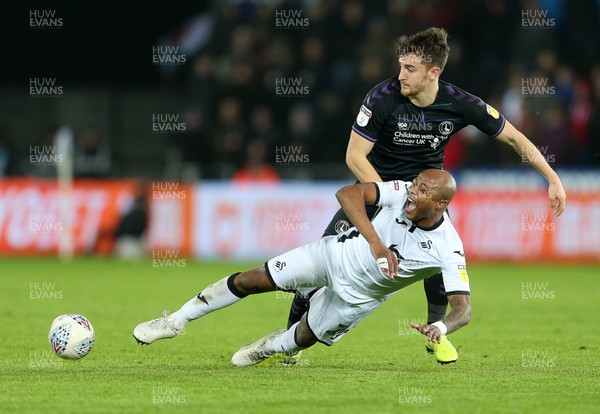 020120 - Swansea City v Charlton Athletic - SkyBet Championship - Andre Ayew of Swansea City is tackled by Tom Lockyer of Charlton Athletic