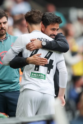 020526 - Swansea City v Charlton Athletic - Sky Bet Championship - Vitor Matos Manager of Swansea City hugs Thomas Woodward of Swansea City as he makes his debut