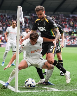 020526 - Swansea City v Charlton Athletic - Sky Bet Championship - Goncalo Franco of Swansea City defends the ball in the corner against Macaulay Gillesphey of Charlton Athletic