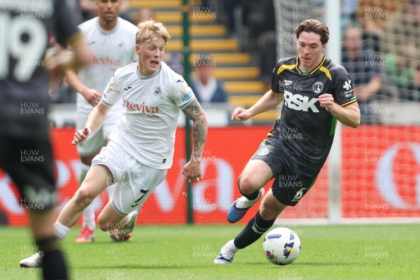 020526 - Swansea City v Charlton Athletic - Sky Bet Championship - Melker Widell of Swansea City and Conor Coventry of Charlton Athletic chase the ball