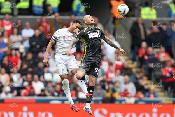 020526 - Swansea City v Charlton Athletic - Sky Bet Championship - Ben Cabango of Swansea City and Lyndon Dykes of Charlton Athletic battle for a header
