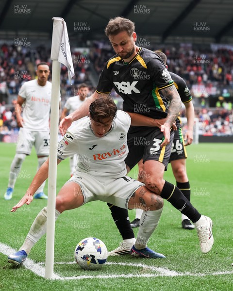 020526 - Swansea City v Charlton Athletic - Sky Bet Championship - Goncalo Franco of Swansea City defends the ball in the corner against Macaulay Gillesphey of Charlton Athletic