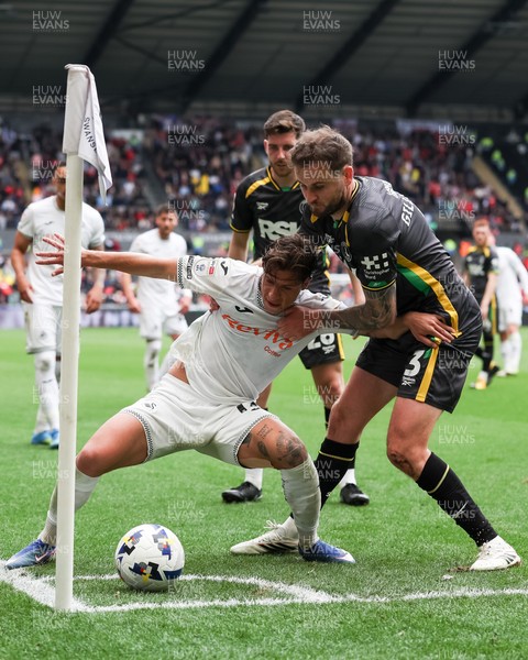 020526 - Swansea City v Charlton Athletic - Sky Bet Championship - Goncalo Franco of Swansea City defends the ball in the corner against Macaulay Gillesphey of Charlton Athletic