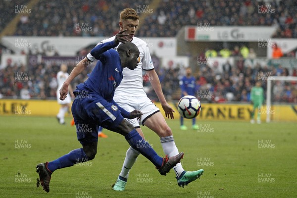 280418 - Swansea City v Chelsea, Premier League - Sam Clucas of Swansea City (right) in action with Ngolo Kante of Chelsea