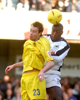 290105 - Swansea City v Chester City - League Two - Swansea's Kevin Austin beats Ian Hillyer to a high ball 