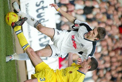 290105 - Swansea City v Chester City - League Two - Swansea's Sam Ricketts takes on Michael Walsh