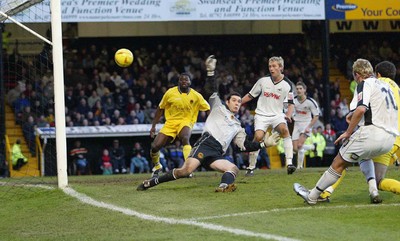 290105 - Swansea City v Chester City - League Two - Swansea's Lee Trundle fires shot pat keeper Chris Mackenzie, but fails to find the net