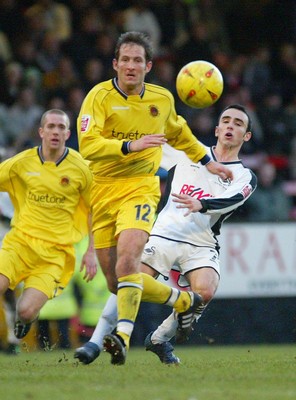 290105 - Swansea City v Chester City - League Two - Swansea's leon Britton is challenged by Andy Harris