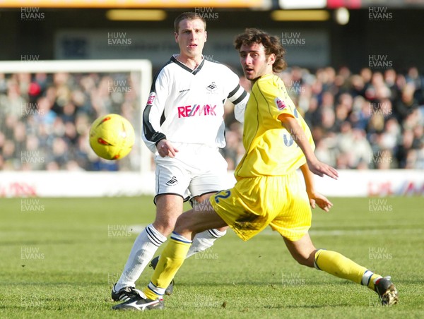 290105 - Swansea City v Chester City - League Two - Swansea's Andy Gurney plays the ball past Michael Brown