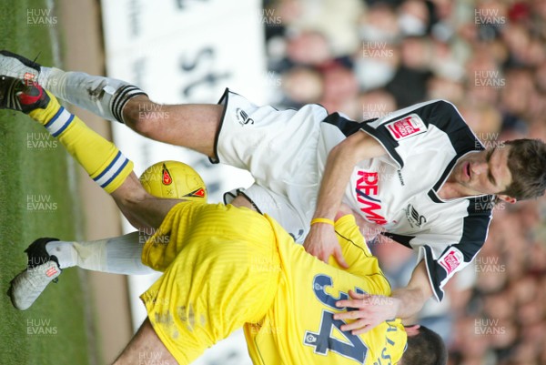 290105 - Swansea City v Chester City - League Two - Swansea's Sam Ricketts takes on Michael Walsh