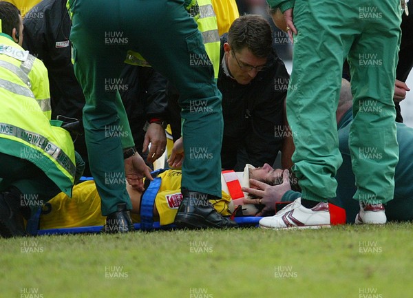 290105 - Swansea City v Chester City - League Two - Chesters Michael Brown receives treatment before being stretchered off after colliding with team-mate