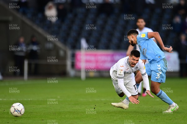 050322 - Swansea City v Coventry City - Sky Bet Championship - Joel Piroe of Swansea City is fouled by Jake Clarke-Salter of Coventry City 
