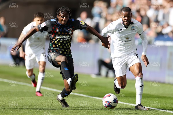 070423 - Swansea City v Coventry City - SkyBet Championship - Olivier Ntcham of Swansea City is challenged by Brooke Norton-Cuffy of Coventry 