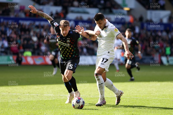 070423 - Swansea City v Coventry City - SkyBet Championship - Joel Piroe of Swansea City is challenged by Kyle McFadzean of Coventry 