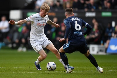 210326 - Swansea City v Coventry City - Sky Bet Championship - Melker Widell of Swansea City is challenged by Matt Grimes of Coventry