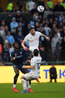 210326 - Swansea City v Coventry City - Sky Bet Championship - Joel Ward of Swansea City is challenged by Ephron Mason-Clark of Coventry