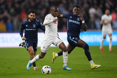 210326 - Swansea City v Coventry City - Sky Bet Championship - Malick Yalcouye of Swansea City is challenged by Frank Onyeka of Coventry