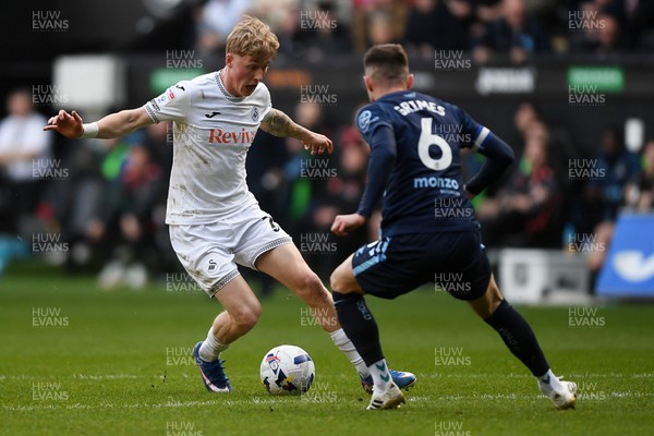 210326 - Swansea City v Coventry City - Sky Bet Championship - Melker Widell of Swansea City is challenged by Matt Grimes of Coventry