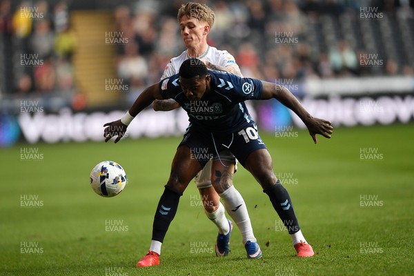 210326 - Swansea City v Coventry City - Sky Bet Championship - Ethan Galbraith of Swansea City is challenged by Ephron Mason-Clark of Coventry