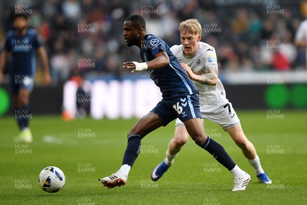 210326 - Swansea City v Coventry City - Sky Bet Championship - Melker Widell of Swansea City is challenged by Frank Onyeka of Coventry