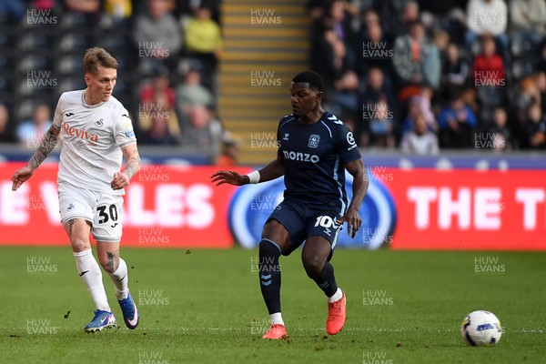 210326 - Swansea City v Coventry City - Sky Bet Championship - Ethan Galbraith of Swansea City is challenged by Ephron Mason-Clark of Coventry