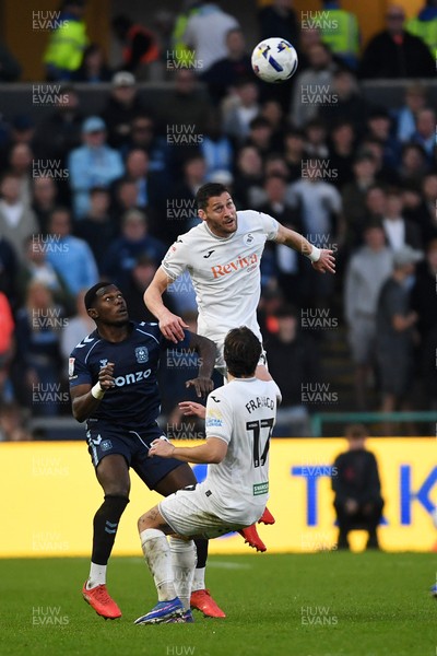 210326 - Swansea City v Coventry City - Sky Bet Championship - Joel Ward of Swansea City is challenged by Ephron Mason-Clark of Coventry