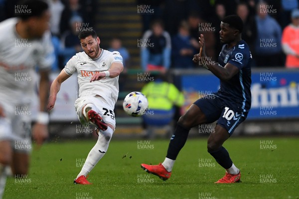210326 - Swansea City v Coventry City - Sky Bet Championship - Joel Ward of Swansea City is challenged by Ephron Mason-Clark of Coventry