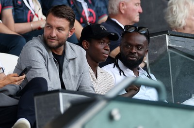 120825 - Swansea City v Crawley Town, Carabao Cup - Swansea City chief executive officer (CEO) Tom Gorringe with new signing Malick Yalcouye in the stands
