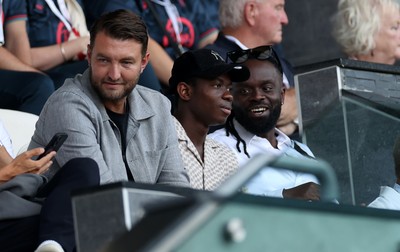 120825 - Swansea City v Crawley Town, Carabao Cup - Swansea City chief executive officer (CEO) Tom Gorringe with new signing Malick Yalcouye in the stands
