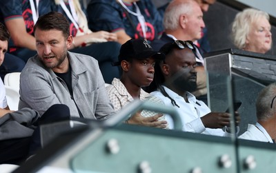 120825 - Swansea City v Crawley Town, Carabao Cup - Swansea City chief executive officer (CEO) Tom Gorringe with new signing Malick Yalcouye in the stands