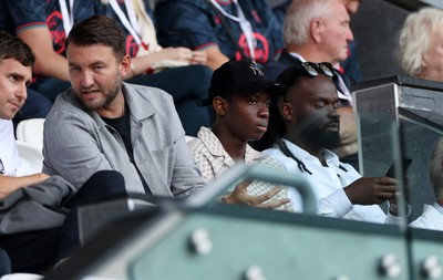 120825 - Swansea City v Crawley Town, Carabao Cup - Swansea City chief executive officer (CEO) Tom Gorringe with new signing Malick Yalcouye in the stands