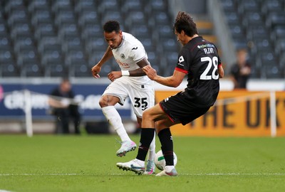 120825 - Swansea City v Crawley Town, Carabao Cup - Ronald of Swansea City is tackled by Josh Flint of Crawley Town 