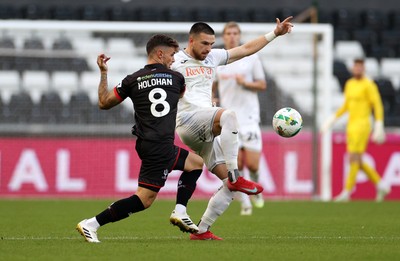 120825 - Swansea City v Crawley Town, Carabao Cup - Zan Vipotnik of Swansea City is challenged by Gavan Holohan of Crawley Town 