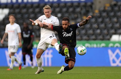 120825 - Swansea City v Crawley Town, Carabao Cup - Antony Papadopoulos of Crawley Town is tackled by Ollie Cooper of Swansea City 