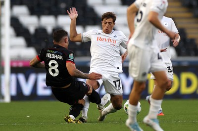 120825 - Swansea City v Crawley Town, Carabao Cup - Gavan Holohan of Crawley Town is given a red card for this tackle on Goncalo Franco of Swansea City 