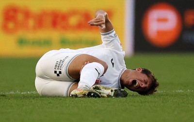 120825 - Swansea City v Crawley Town, Carabao Cup - Goncalo Franco of Swansea City goes down injured