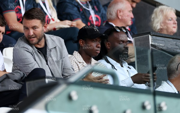 120825 - Swansea City v Crawley Town, Carabao Cup - Swansea City chief executive officer (CEO) Tom Gorringe with new signing Malick Yalcouye in the stands