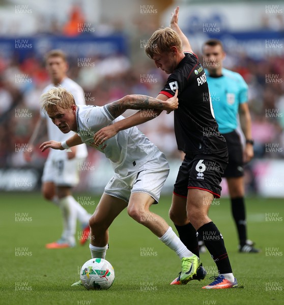 120825 - Swansea City v Crawley Town, Carabao Cup - Melker Widell of Swansea City is challenged by Max Anderson of Crawley Town 
