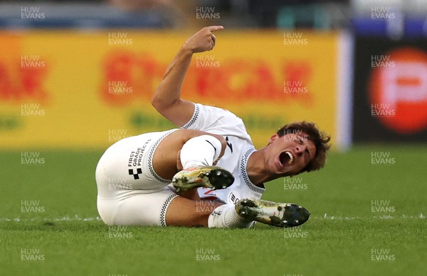 120825 - Swansea City v Crawley Town, Carabao Cup - Goncalo Franco of Swansea City goes down injured