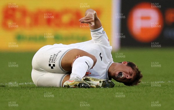 120825 - Swansea City v Crawley Town, Carabao Cup - Goncalo Franco of Swansea City goes down injured
