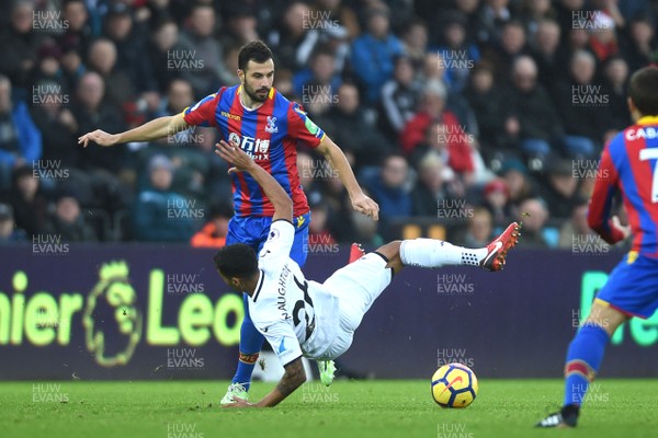 231217 - Swansea City v Crystal Palace - Premier League - Kyle Naughton of Swansea City is tackled by Yohan Cabaye of Crystal Palace