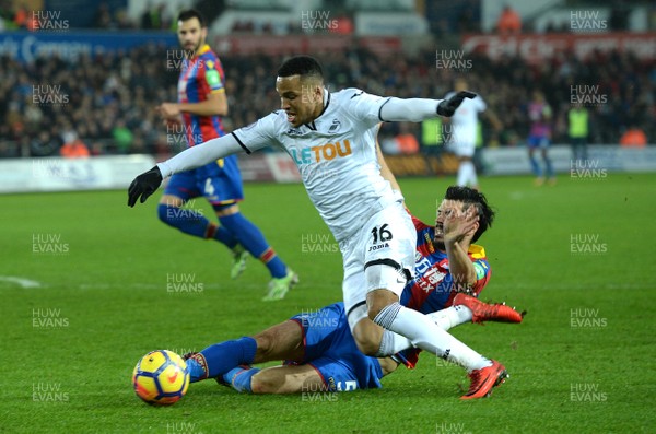 231217 - Swansea City v Crystal Palace - Premier League - Martin Olsson of Swansea City is tackled by James Tomkins of Crystal Palace