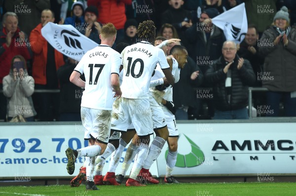 231217 - Swansea City v Crystal Palace - Premier League - Swansea players celebrate Jordan Ayew goal