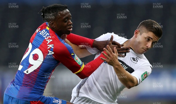 280818 - Swansea City v Crystal Palace - Carabao Cup - Declan John of Swansea City is tackled by Aaron Wan-Bissaka of Crystal Palace