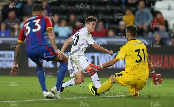 280818 - Swansea City v Crystal Palace - Carabao Cup - Daniel James of Swansea City can't get the ball past keeper Vicente Guaita of Crystal Palace